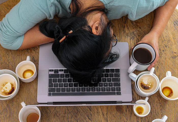 overworked women sleeping on the laptop