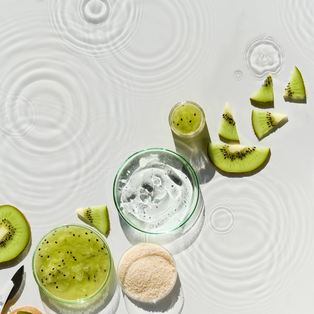 Cosmetic Skincare Background. Herbal Medicine with Kiwi Slices and Palm Leaves. Homemade Sugar Scrab. Natural Sunlight, Shadows. Splashes, Water Circles. Natural Skincare Background